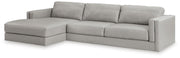 Ashley Furniture Amiata sectional with chaise, featuring plush fabric upholstery and modern design, shown from an angled side view.