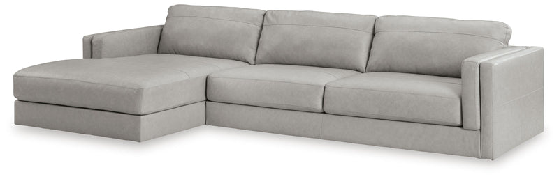 Ashley Furniture Amiata sectional with chaise, featuring plush fabric upholstery and modern design, shown from an angled side view.