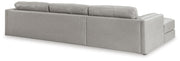 Ashley Furniture Amiata sectional with chaise, showing plush fabric upholstery and a spacious L-shaped design from the back view.
