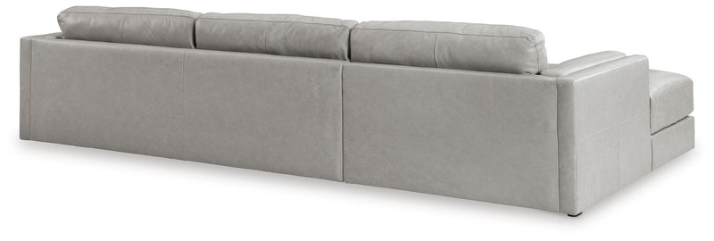 Ashley Furniture Amiata sectional with chaise, showing plush fabric upholstery and a spacious L-shaped design from the back view.