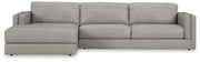 Ashley Furniture Amiata sectional with chaise, showing beige fabric upholstery and plush seating with a modern design.