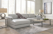 Ashley Furniture Amiata sectional with chaise, featuring plush cushions and contemporary design in a neutral fabric.