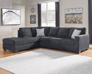 Ashley Furniture Altari sleeper sectional with chaise, showing plush fabric upholstery and modern design in a cozy living room setting.