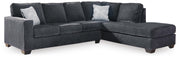 Ashley Furniture Altari sleeper sectional with chaise, showing beige fabric upholstery and modern sectional design.