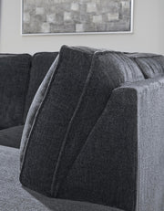 Ashley Furniture Altari Sleeper Sectional with Chaise, showing close-up of fabric, chaise lounge, and sofa details in a modern living room.