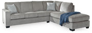Ashley Furniture Altari sleeper sectional with chaise, featuring plush upholstery and a modern design in a spacious living room setting.