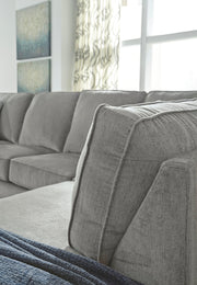 Altari Sleeper Sectional with Chaise by Ashley Furniture showing plush fabric, chaise lounge, and convertible sleeper bed.