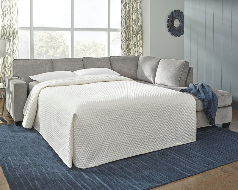 Ashley Furniture Altari sleeper sectional with chaise, showing plush fabric upholstery and spacious seating arrangement.