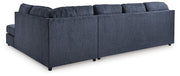 Ashley Furniture Albar Place sectional sofa with plush cushions and fabric upholstery, shown from the back view.