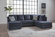 Ashley Furniture Albar Place sectional sofa with plush cushions and modern design, shown in a cozy living room setting.