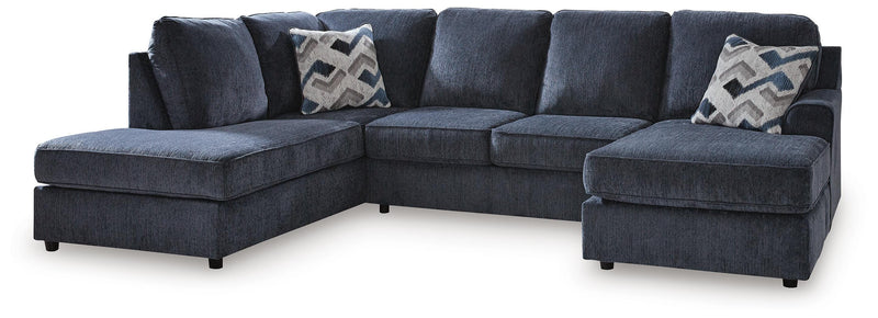 Ashley Furniture Albar Place sectional sofa with plush cushions and modern design, shown in a stylish living room setting.