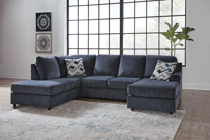 Ashley Furniture Albar Place sectional sofa with plush cushions and modern design, shown in a neutral fabric.