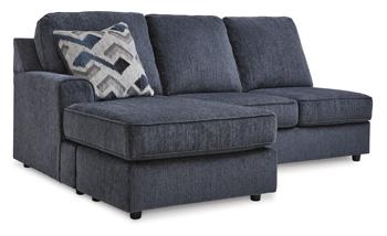 Ashley Furniture Albar Place sectional sofa with plush cushions and modern design, shown in a spacious living room setting.