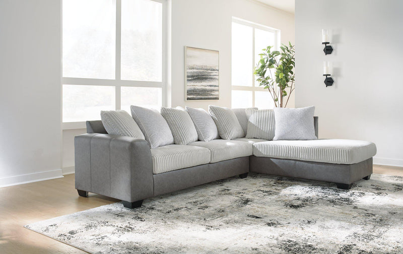 Ashley Furniture Clairette Court sectional with chaise, featuring plush fabric, modern design, and spacious seating.