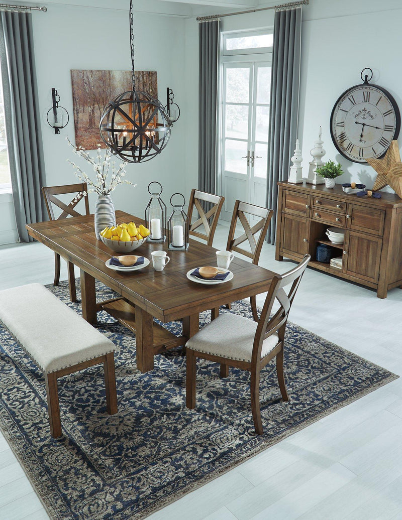 Ashley Moriville dining room set with a wooden table and six matching chairs in a modern dining space.