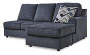 Ashley Furniture Albar Place sectional sofa with plush cushions and modern design, shown in a stylish living room setting.