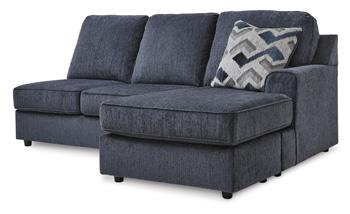 Ashley Furniture Albar Place sectional sofa with plush cushions and modern design, shown in a stylish living room setting.
