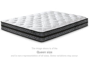 10-inch Ashley Furniture hybrid mattress with pocketed coil support and plush top, shown on a bed frame.