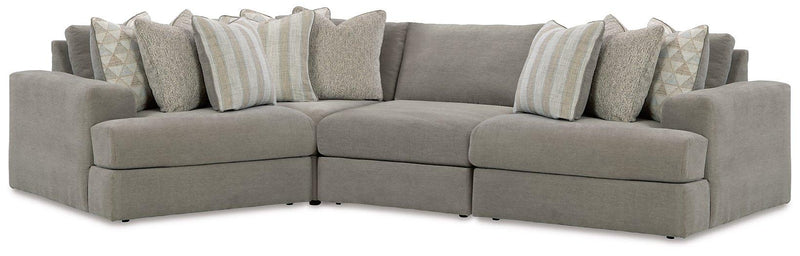 Ashley Furniture Avaliyah sectional sofa with plush cushions and neutral fabric, shown in a modern living room setting.
