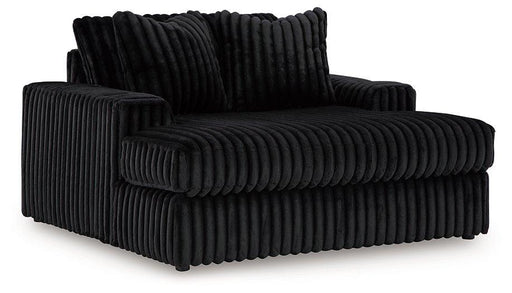 Ashley Furniture Midnight-Madness Oversized Chaise chair with plush upholstery and modern design, perfect for a stylish living room.