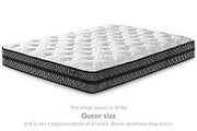 10-inch Ashley Furniture hybrid mattress with pocketed coils and foam layers, shown on a bed platform.