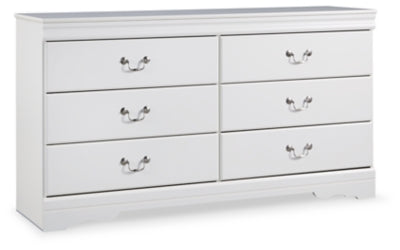 Ashley Furniture Anarasia dresser with multiple drawers and a sleek finish, shown in a modern bedroom setting.