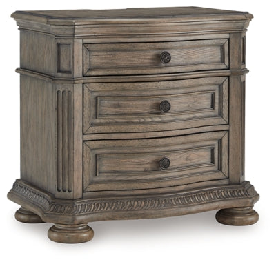 Ashley Furniture Ardenfield Nightstand with a closed drawer and sleek wooden finish, shown from an angled side view.