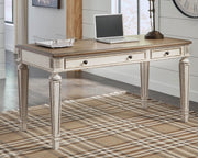 Ashley Furniture Realyn home office set with desk and shelving unit, featuring a modern design and wood finish.