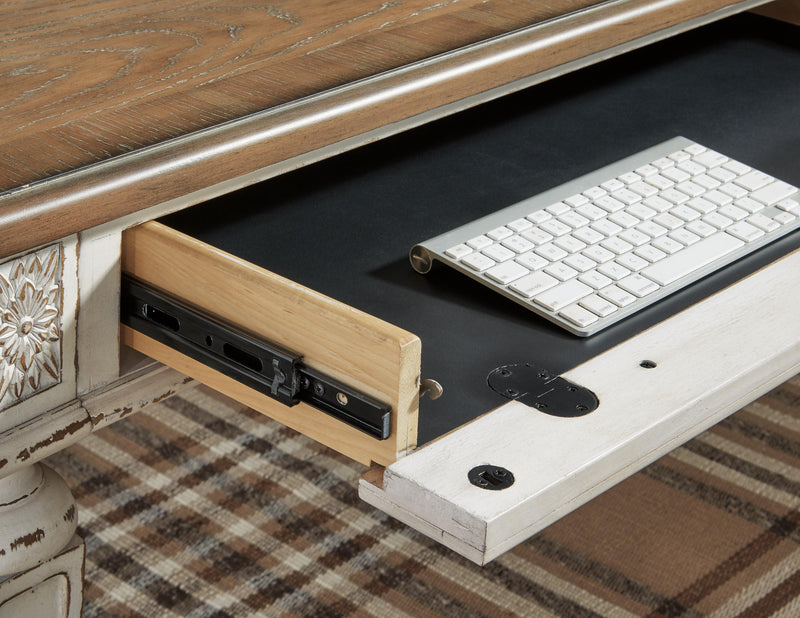 Ashley Furniture Realyn Home Office Set with desk, chair, and storage components arranged in a modern workspace scene.