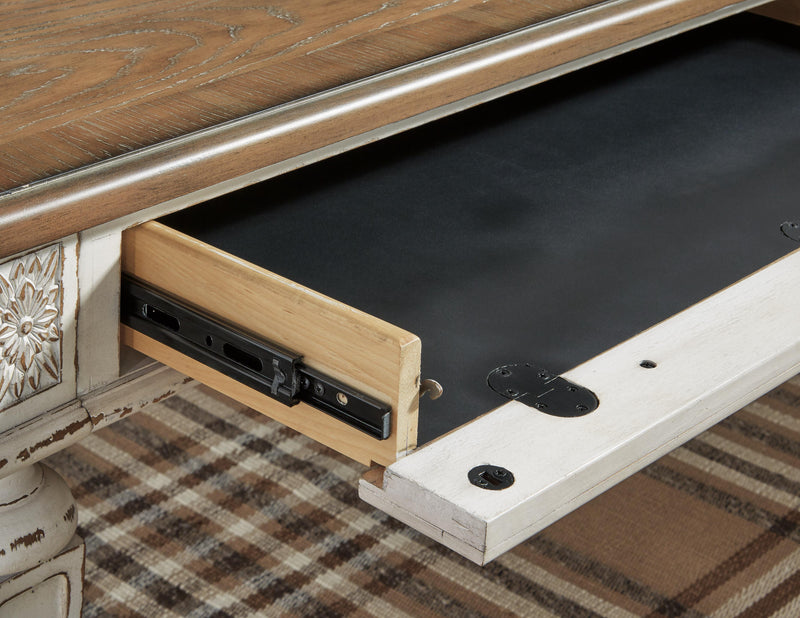 Detail view of the Ashley Furniture Realyn Home Office Set, showcasing the desk and storage components.