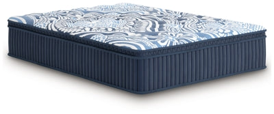 Ashley Furniture Plush Luxe 2.0 innerspring mattress shown from an angle, featuring a plush top and supportive coil system.