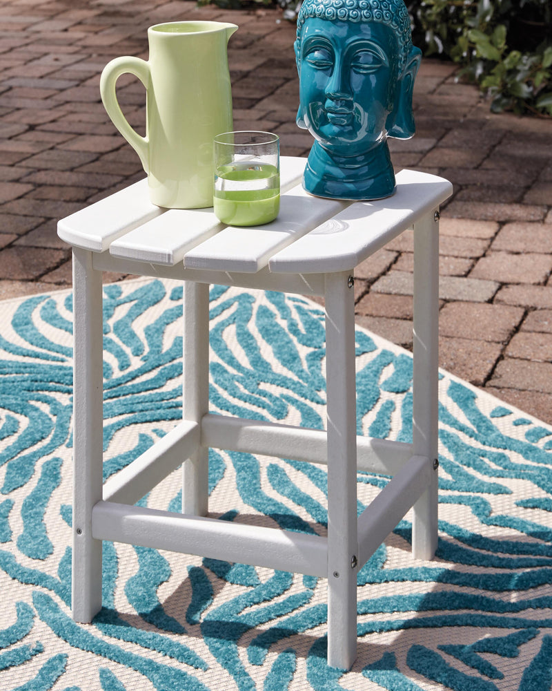 Outdoor table set from Ashley Furniture's Sundown Treasure collection, featuring a table and seating for outdoor relaxation.