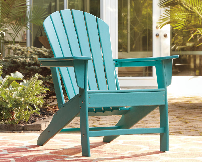 Outdoor table set by Ashley Furniture featuring a spacious table and matching chairs, perfect for outdoor dining and entertaining.