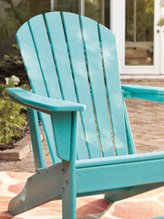 Outdoor table set by Ashley Furniture featuring a Sundown Treasure design, includes a table and matching seating for outdoor use.