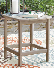 Outdoor table set from Ashley Furniture's Sundown Treasure collection, featuring a table and surrounding seating for outdoor use.