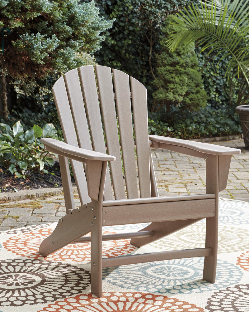 Outdoor seating set by Ashley Furniture with a table and chairs, perfect for outdoor dining and relaxing in a backyard setting.
