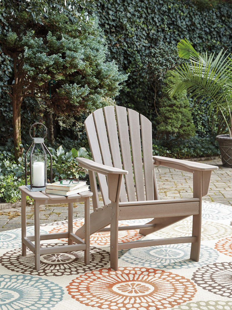 Outdoor table set from Ashley Furniture's Sundown Treasure collection with a glass-top table and matching chairs.