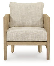 Two Ashley Furniture Spooners Cove outdoor lounge chairs with cushions, featuring a modern design and sturdy frame for outdoor relaxation.