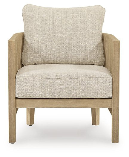 Two Ashley Furniture Spooners Cove outdoor lounge chairs with cushions, featuring a modern design and sturdy frame for outdoor relaxation.