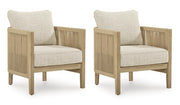 Set of two Ashley Furniture Spooners Cove outdoor lounge chairs with cushions, featuring weather-resistant design and modern outdoor style.